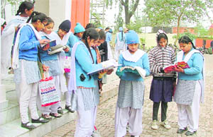 Students of Khalsa Malwa Girls’ School revising their paper ahead of an examination in Ludhiana on Wednesday.