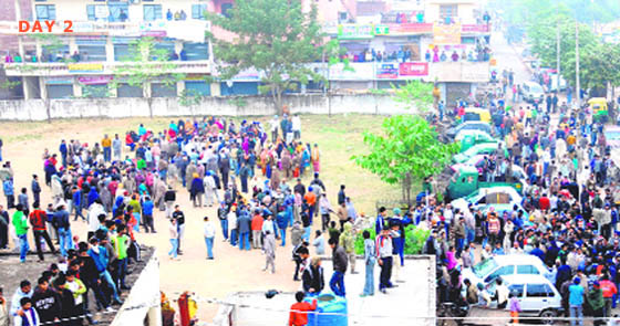 Residents gather on the Ramlila Ground in Burail village on Thursday.