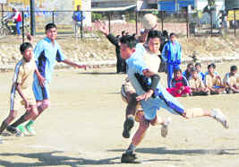 Hockey and (right) handball matches in progress at the Panchayat Sports Meet in Dehradun on Thursday.