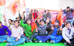 Workers of the Akhil Bharatiya Vidyarthi Parishad hold a demonstration against corruption at the Gandhi Park in Dehradun