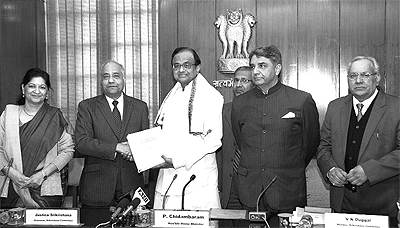 Above: Retired SC judge B. N. Srikrishna (2nd from left) and other members of the committee hand over the report on Telangana to the Union Home Minister, P. Chidambaram
