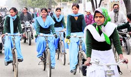 Girl students on their way back home after the government announced the closure of schools for a week due to intense cold in Karnal on Thursday.