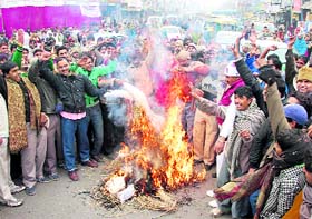 Members of the Karnal Meat Shops Association hold a protest at Committee Chowk on Thursday against the decision of the district administration to shift meat shops outside the city.