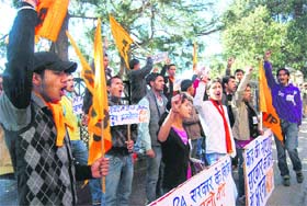 Activists of the ABVP raise slogans against the UPA government in Shimla on Thursday.
