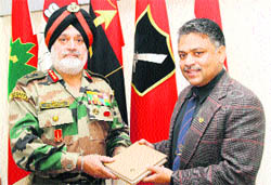 Lt Col Biplab Nath, PRO, Defence, Jammu, presents a photo album to Lt-Gen Jasbir Singh at HQ, Northern Command, in Jammu