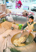 A street vendor roasts groundnuts in Jalandhar