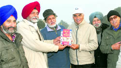 Olympians Darshan Singh and Col Balbir Singh release a book Hockey Da Ghar Sansarpur in Jalandhar on Thursday