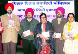 Deputy Commissioner K.S. Pannu releases an album by Punjabi folk singer Gurmeet Bawa in Amritsar