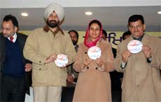 Transport Minister Master Mohan Lal, MP Harsimrat Kaur Badal and SSP Sukhchain Singh Gill releasing the sticker prepared by the Bathinda police to initiate action against wrong parking, in Bathinda on Friday. Also seen in the picture is Transport Secretary SK Sandhu.