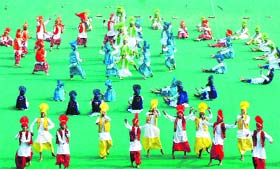 Students perform at the opening ceremony of the 56th National School Games at the Sector 42 Hockey Stadium in Chandigarh on Friday. 