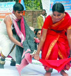 Telangana United Program Committee activists perform during a dharna for their demand for a separate state at Jantar Mantar in New Delhi on Friday.