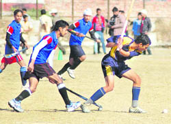 Hockey and handball matches in progress at the Rajya Yuva Kalyan Parishad Games in Dehradun on Friday