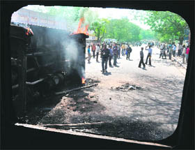 A government bus that was set afire by pro-Telangana students in Hyderabad.