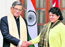 External Affairs Minister SM Krishna with his Nepalese counterpart Sujata Koirala in New Delhi on Friday