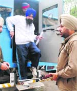 Balwant Singh alights from a vehicle in the district court complex in Patiala on Friday.