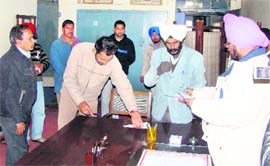 ADC Sukhwinder Pal Singh Mrar conducting a surprise check at a government office in Ropar on Friday.