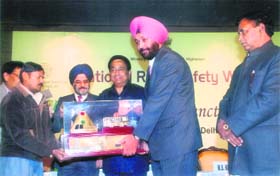 Mandeep Singh, director, state transport, Punjab, receives the national award for the minimum accident rate in the country from Union Minister for Road Transport Kamal Nath in New Delhi on Friday.