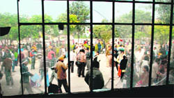A windowpane broken by aspirants at the office of the DIET in Panchkula on Saturday