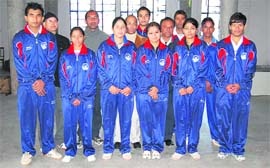 The Garhwal University table tennis team that has been selected for the North Zone TT Championship poses along with their coaches.