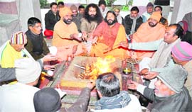 Saints perform hawan at Arya Samaj Ved Mandir, Jwalapur, in Haridwar on Saturday.