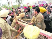 The police tries to stop agitating members of the ITI Instructors (Contract) Union from proceeding to Badal village on the outskirts of Lambi village on Saturday.