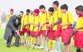 Olympian Pargat Singh with budding hockey players in Jalandhar