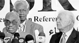 Former US President Jimmy Carter (right) with Southern Sudan Referendum Commission Chairman Mohamed Ibrahim Khalil at a news conference in Khartoum on Friday.