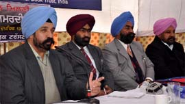 Chief editor of the National Book Trust Baldev Singh Badhan along with other dignitaries addresses mediapersons at the Book Fair on Sunday.