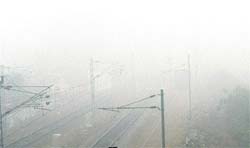 Thick blanket of fog engulfs the Rajpura railway station. 
