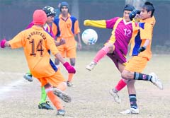 A football match in progress between Karnataka and Himachal Pradesh at GMSSS, Sector 22, Chandigarh, on Sunday. 