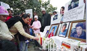 Family members of Nihkil Kadyan, Samantha, Divay Sharma and Siddarth, killed last month in an accident at Gazipur border, hold a candlelight march to demand arrest of the accused in New Delhi