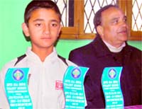 Myukh Rawat, winner of the national tennis talent series single and doubles events held in Lucknow recently, in Dehradun on Sunday