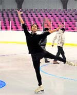 A girl trains at the ice-skating rink