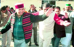 Sports and Disaster Management Minister Khajan Das dances along with members of the 