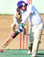A batsman hits the ball in the Uttarakhand Twenty20 League