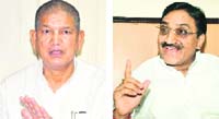 Union Minster of State Harish Rawat and (right) Uttarakhand Chief Minister Ramesh Pokhriyal Nishank