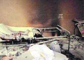 A burnt cot in a hotel room in Tohana where four workers were suffocated to death