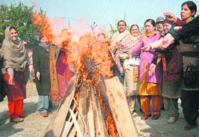 Bonfire to celebrate the festival in Jammu on Sunday.