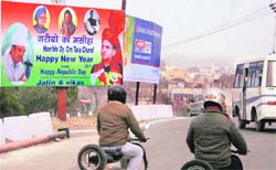 A huge billboard proclaiming Deputy Chief Minister Tara Chand as Messiah of the poor at Brigadier Rajinder Singh Chowk in Jammu