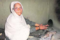  Krishna Devi, a descendant of legendary Dogra warrior General Zorawar Singh, in her hut at Vijaypur village, near Reasi. 