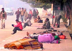 The poor sleep in the open on a chilly evening in Ludhiana