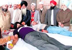 Volunteers donate blood at a camp in Ludhiana on Sunday