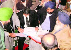 Chief Minister Parkash Singh Badal interacts with office-bearers of a civic body during a sangat darshan programme at Sihar village, near Ahmedgarh, on Sunday