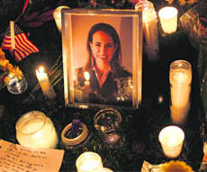Candles surround a portrait of Gabrielle Giffords who was shot at in Tuscon, Arizona, on Saturday. 