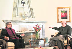 Afghan President Hamid Karzai with Minister for Foreign Affairs SM Krishna during a meeting in Kabul on Sunday.