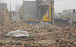 A view of a damaged house at Phallianwala village.