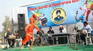 A folk singer performs during the function held at Padampur.