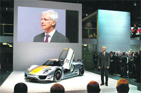 Matthias Miller, President and CEO of Porsche, introduces the new Porsche 918 RSY to the media at the 2011 North American International Auto Show in Detroit, Michigan on Monday. Approximately 4,500 journalists from over 60 countries are attending the NAIAS, which features more than 30 worldwide debuts of vehicles by automotive manufacturers from around the world.