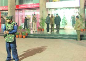Policemen stand outside Fun Republic in Mani Majra, Chandigarh