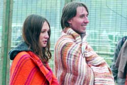 Shawl comfort: Foreign visitors at India Gate in New Delhi on Monday.